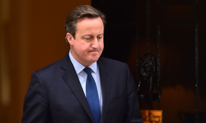 Prime Minister David Cameron leaves to speak to the media outside 10 Downing Street, London, where he said that if the US airstrike was successful, the killing of 'barbaric' British IS militant Mohammed Emwazi, known as Jihadi John, was the 'right thing to do'. PRESS ASSOCIATION Photo. Picture date: Friday November 13, 2015. See PA story POLITICS Terror. Photo credit should read: Dominic Lipinski /PA Wire