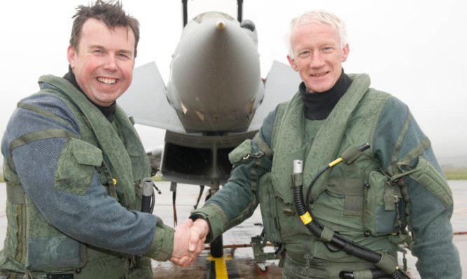 Sir Stephen Dalton (right) meeting  Wing Commander Mike Baulkwill.