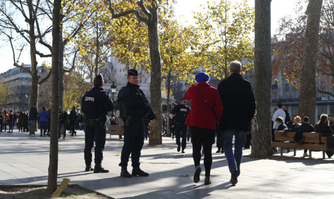 Police on patrol in Place de la Republique in Paris following the terrorist attacks in the French capital on Friday night which claimed the lives of a least 129 people.