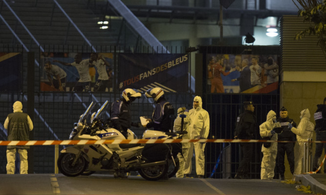 French officials work outside the Stade de France, where France played Germany in an international football friendly.