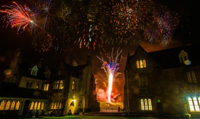 Pupils at Glenalmond College in Perthshire gather to celebrate taking part in what is thought to be the worlds first continuous global reunion in a 24 hour period.