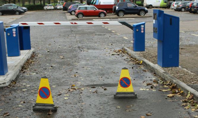 The dented ticket machine at the entrance to the North Inch car park.