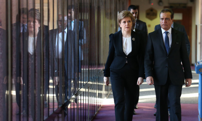 Nicola Sturgeon with Glasgow Central Mosque President Maqbool Rasul after they both observed a minute's silence to mark the victims of Friday's attacks in Paris.