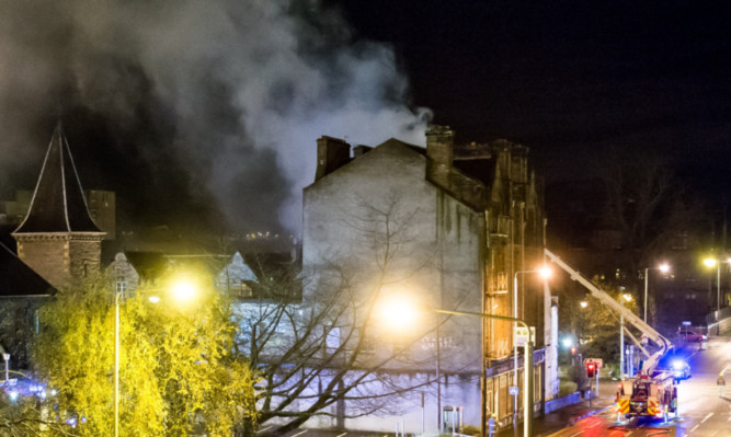 Firefighters tackle the Waverley Hotel  blaze at its height.