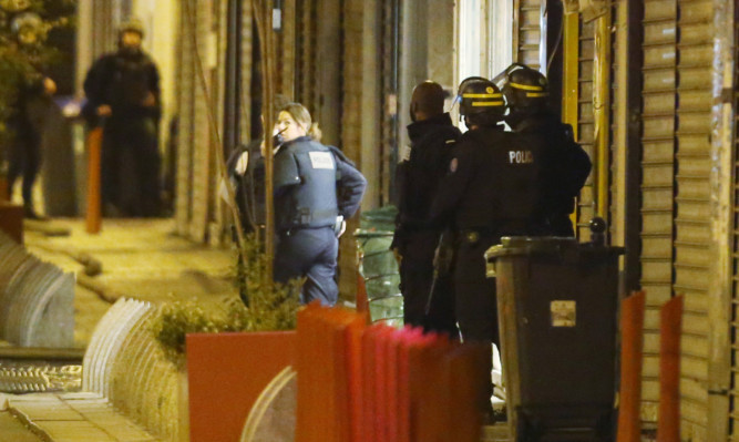 Police activity during the raid on an apartment in the Saint-Denis suburb of Paris.