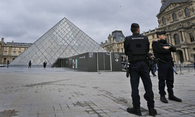 Police on patrol outside the Louvre in Paris after Fridays terrorist attacks.