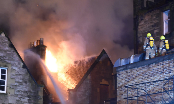 A massive fire ripped through the derelict Waverley Hotel in Perth on Tuesday night. Firefighters spent almost four hours bringing the flames under control. These dramatic images were taken by local photographer Stuart Cowper. See more at www.thecourier.co.uk/1.910948.