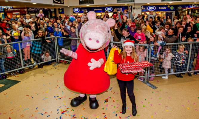 Peppa Pig and competition winner Skye Hume, 10, from Glenrothes, at the Kingdom Centre.