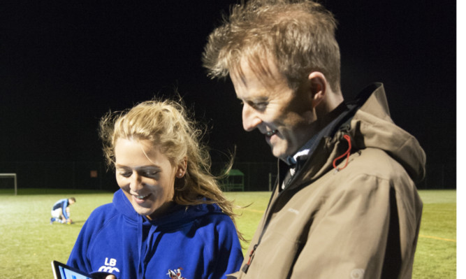 The Courier's Michael Alexander undergoes the King-Devick Test under the watchful eye of Howe of Fife Rugby Club physiotherapist Lianne Brunton