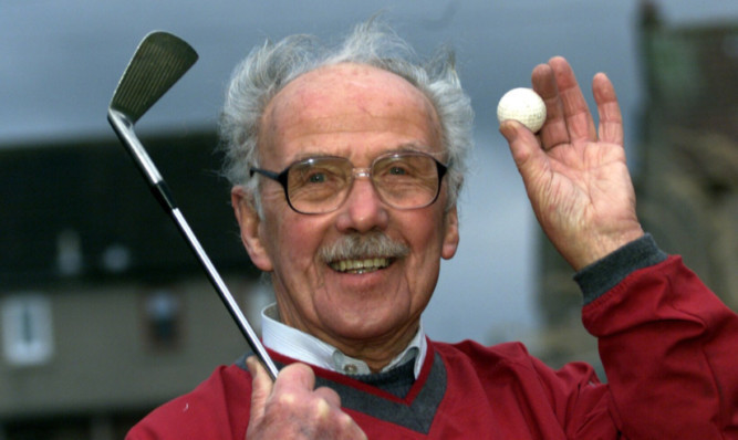 Mr Suttie was a keen golfer and is seen celebrating a hole-in-one.