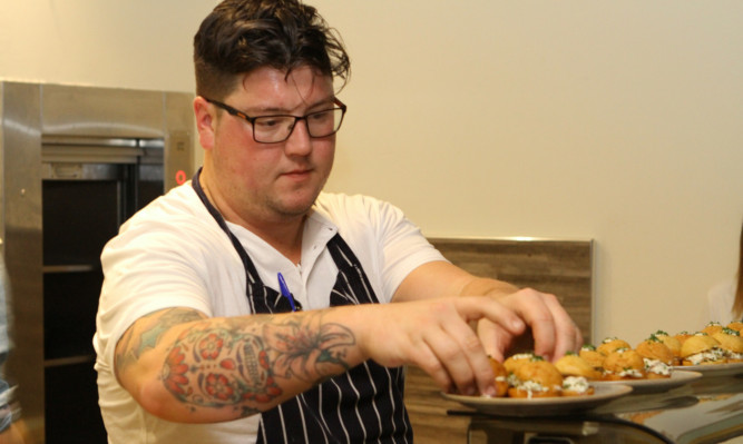 Jamie prepares his dishes for the diners in Dundee.