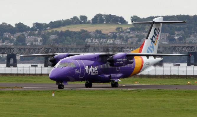 Kris Miller, Courier, 26/09/15. Picture today shows a Flybe plane at Dundee airport.