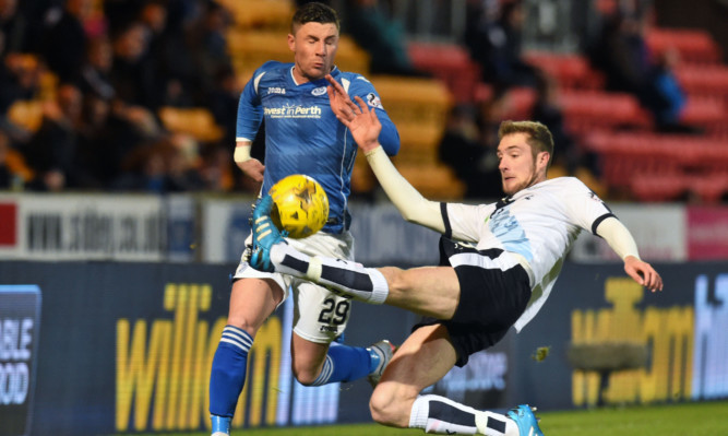 Dundee's Kevin Holt (right) challenges St Johnstone's Michael O'Halloran.
