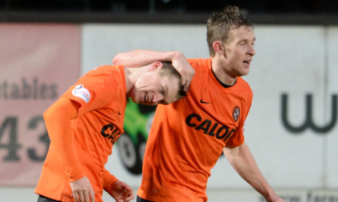 Billy Mckay (left) celebrates his opening goal.