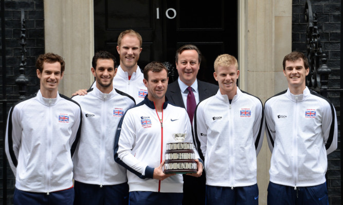 Prime Minister David Cameron, stands with winning Davis Cup team members (left to right) Andy Murray, James Ward, Dominic Inglot, Leon Smith, Kyle Edmund and Jamie Murray, on the steps of 10 Downing Street.