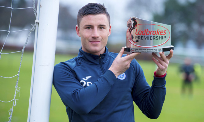 Michael O'Halloran with his player of the month award.