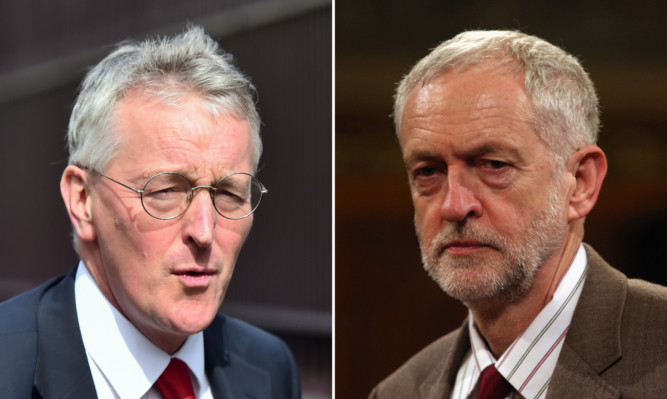 Jeremy Corbyn, right, has warned plotting MPs they could ruin Labour by backing Hilary Benn, left, to replace him as leader following the Shadow Foreign Secretary's impassioned speech in favour of bombing Syria