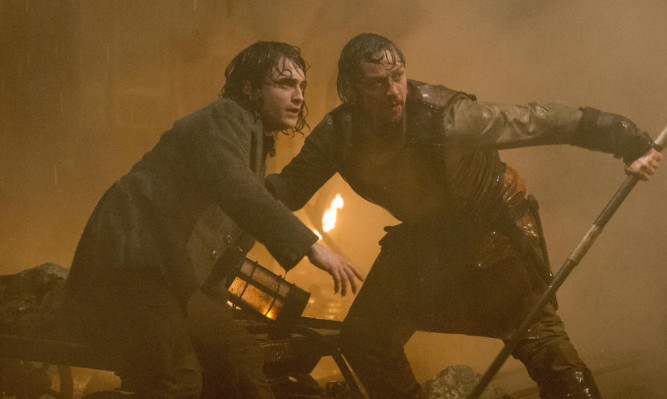 Daniel Radcliffe as Igor and James McAvoy as Frankenstein.