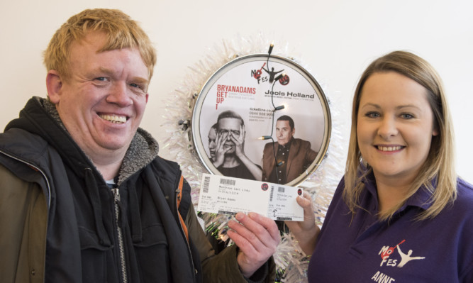 Jason Lindsay was one of the first in the queue to get his tickets from MoFest's Anne Jenkins.