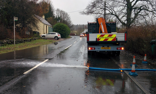 Flood water is pumped from a property at Glenfarg.