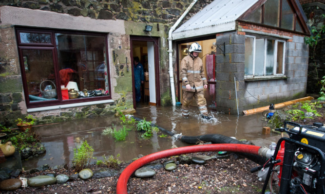 Scottish Fire and Rescue crews helped to pump water from the flooded homes in Glenfarg.