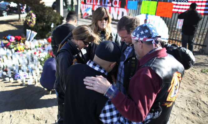 Mourners in San Bernardino, California, after last week's gun attack.