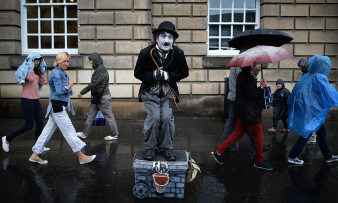 The show goes on whatever the weather at the Edinburgh Festival during the summer.
