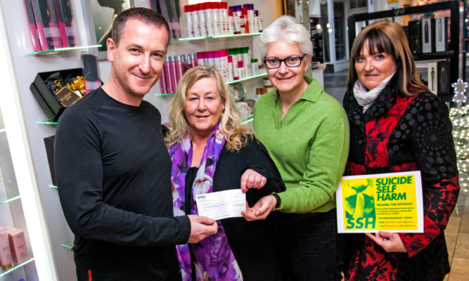 John Gillespie Hairdressing, St John Street, Perth, presented cheques to local mental health charities following a fundraising event. From left: Mr Gillespie, Kirstie Howell (Suicide Self Harm), Gillian Milne (Mindspace) and Tracy Swan.
