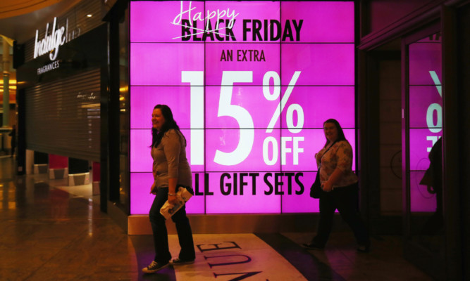 MANCHESTER, UNITED KINGDOM - NOVEMBER 27:  Shoppers arrive at The Trafford Centre, and wait for the shops to open in the hope of a 'Black Friday' bargain on November 27, 2015 in Manchester, United Kingdom. Retailers have seen a slow start of shoopers arriving at stores for the 'Black Friday' sales with many shoppers pruchasing bargains online. Analysts are predicting record online sales of discounted goods. Many stores are also distributing discounted goods across the weekend to avoid the hectic scenes of bargain hunters in previous years.  (Photo by Christopher Furlong/Getty Images) ***BESTPIX***