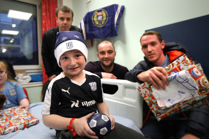 Dundee FC players made their annual visit to Ninewells Hospital on Tuesday. Players and staff brought sack loads of gifts for patients in the childrens medical ward, surgical ward and outpatient clinics and also visited adult patients in one of the orthopaedic wards. Fans also had the opportunity to get autographs and pose for photographs with their favourite players.