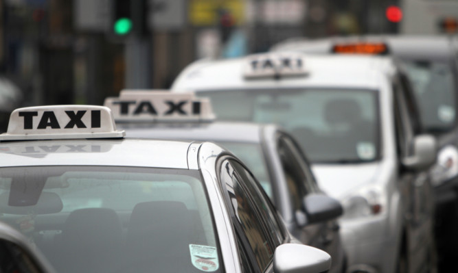 Kris Miller, Courier, 31/03/14. General view of taxis at the taxi rank in the Nethergate, Dundee for files.