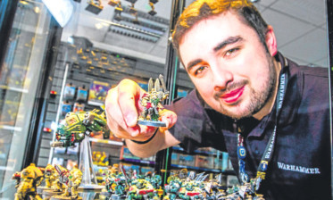 Scott Irvine with some of the 'Warhammer 40,000 ' figures.