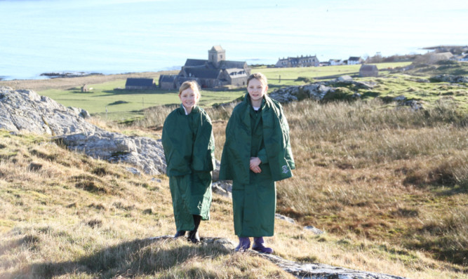From left: Iona Morgan and Iona Billinge, singing Iona on the island of Iona.
