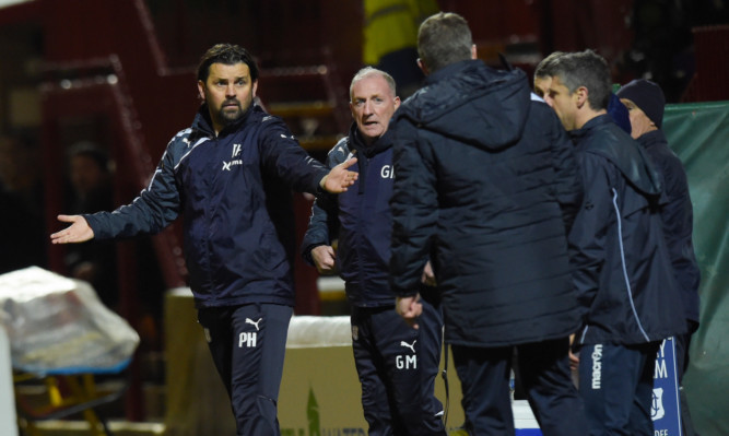 Paul Hartley expresses his feelings in the dugout.