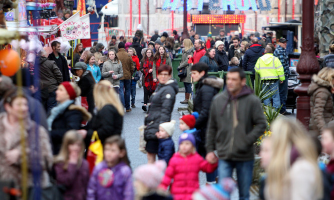 Busy scenes at the fairground rides.