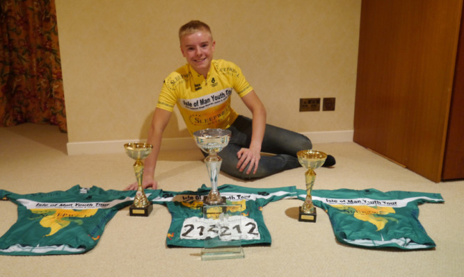 Alfie George with some of the trophies hes won.
