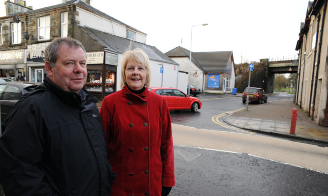 Area services manager Kevin Sayer and Irene Burt at the street that has been nicknamed Bono after the U2 singer.