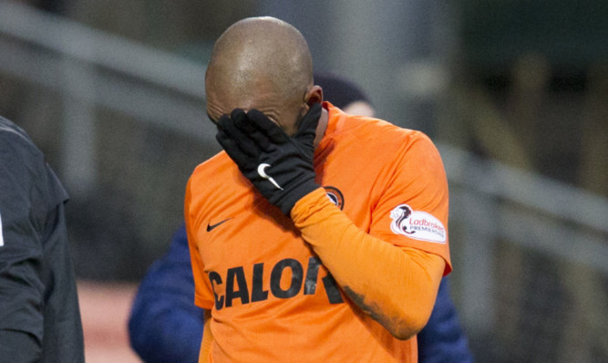 A dejected Florent Sinama Pongolle comes off on Saturday.