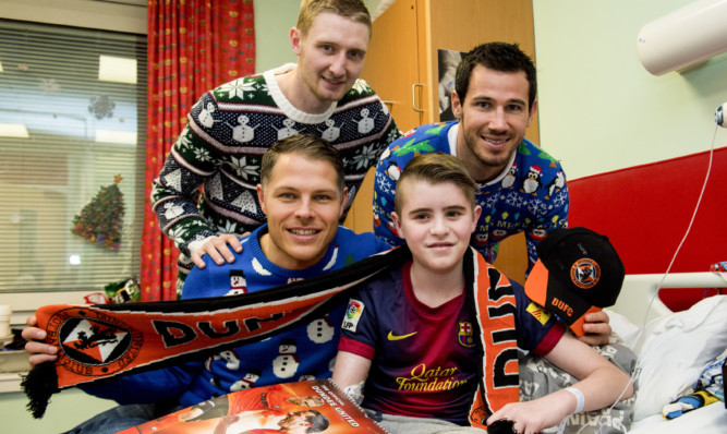 From left: John Rankin, seated, Chris Erskine and Ryan McGowan with young Bailey Dixon.