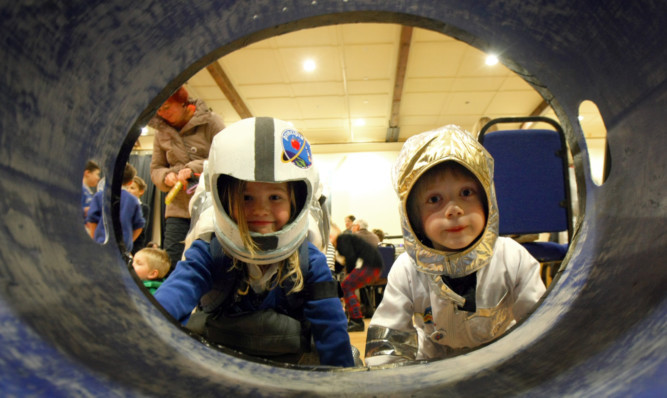Isla Harrower and Rannoch Donaldson dress as astronauts at the White Church in Comrie.
