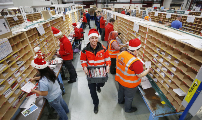 Employees at Royal Mail's Glasgow Mail Centre handle millions of items during the Christmas rush on the centre's busiest day of the year.