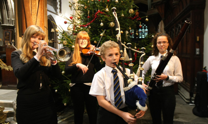 Perth High pupils (from left) Lindsey Maycock, Morven Forsyth, Krzysztof-Cameron Black and Shona Rae holding a dress rehearsal for their Christmas Concert.