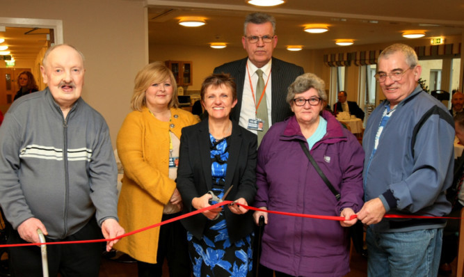 Cutting the ribbon at the opening are resident Ian Donaldson, Councillors Carol Lindsay, Judy Hamilton and Andrew Rodger and residents Margaret and Jim Napier.