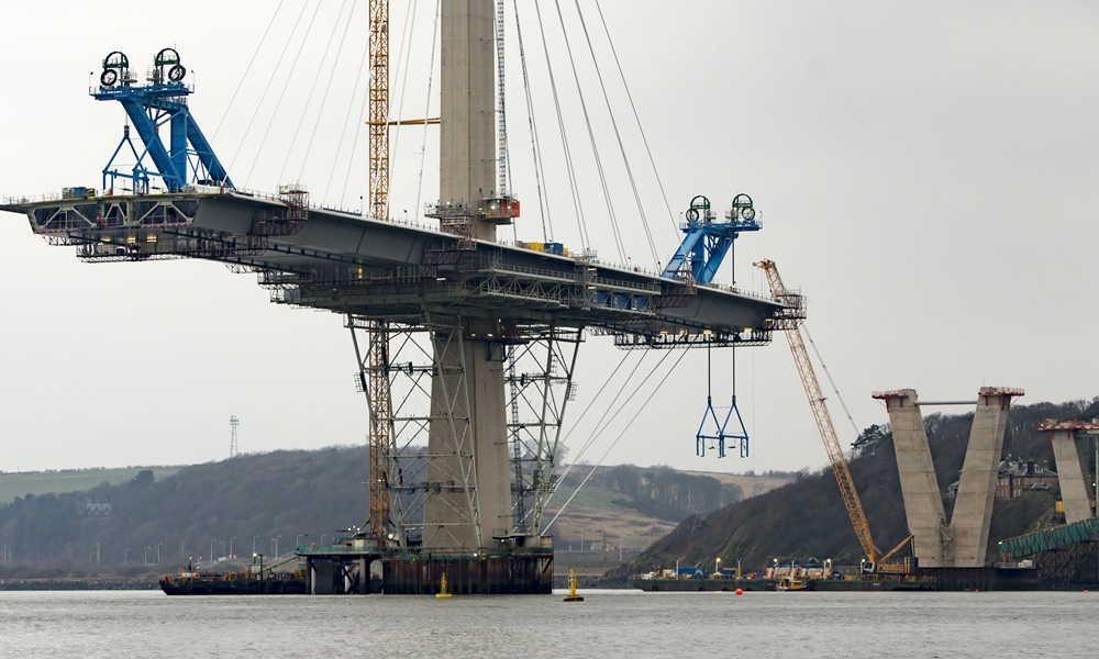 Work continues on the Queensferry Crossing in Scotland with over a quarter of the deck now in place.  PRESS ASSOCIATION Photo. Picture date: Tuesday December 15, 2015. More than a quarter of the bridge deck is now in place on the Queensferry Crossing with a year to go before opening.  Mr Brown visited the under-construction crossing over the Firth of Forth to view progress on the project, costing £1.35 billion to £1.4 billion. See PA story SCOTLAND Bridge. Photo credit should read: Danny Lawson/PA Wire