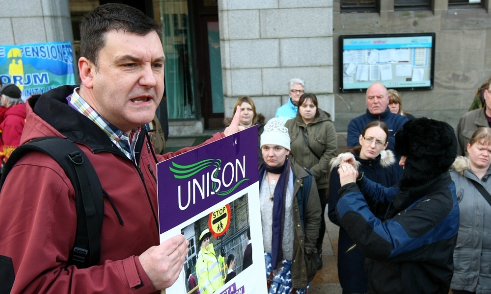 COURIER, DOUGIE NICOLSON, 12/02/15, NEWS.
Pic shows Jim McFarlane - Branch Secretary for Unison, addressing the budget protestors outside the City Chambers in Dundee today, Thursday 12th February 2015. Story by reporters.