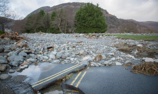 Rubble and stones are  left on the shoreline of Ullswater Llake next to the Cumbrian village of Glenridding.