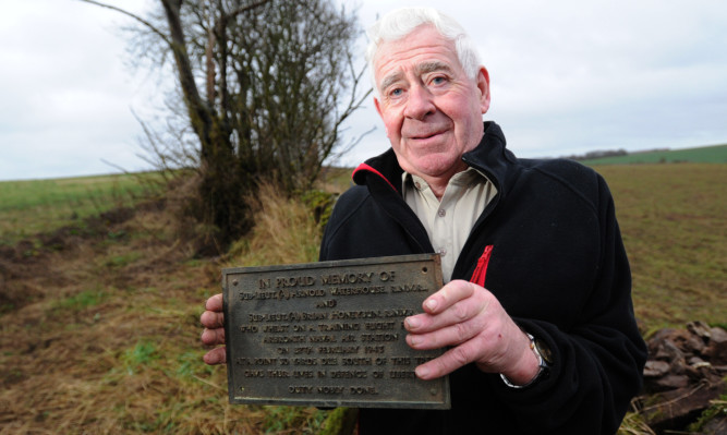 Dave Lumgair with the memorial plaque.