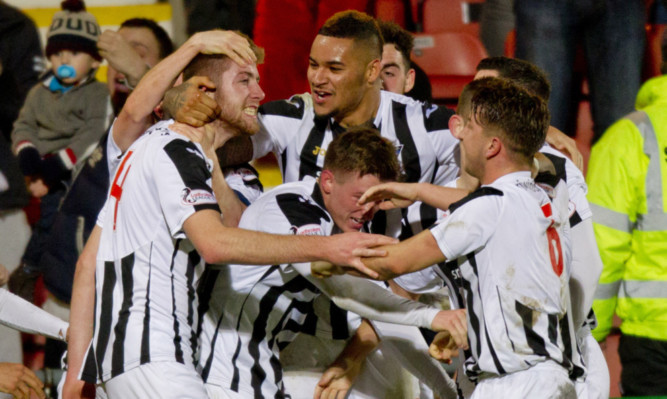 Dunfermline players congratulate Shaun Rooney, left, after he scored the only goal of the game against Stenhousemuir.