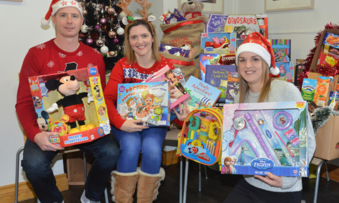 Cupar-based social worker Victoria Leonard who co-ordinates Toy Drive, a charity set up by her three years ago. Pictured (from left)  Lee Shaw, Victoria Leonard and Laura Lumsden.