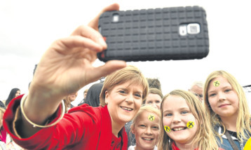 First Minister Nicola Sturgeon says she has posed for hundreds of thousands of selfies this year.